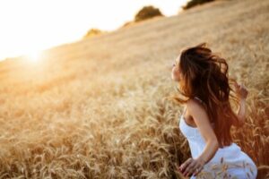 A beautiful woman running in a field.